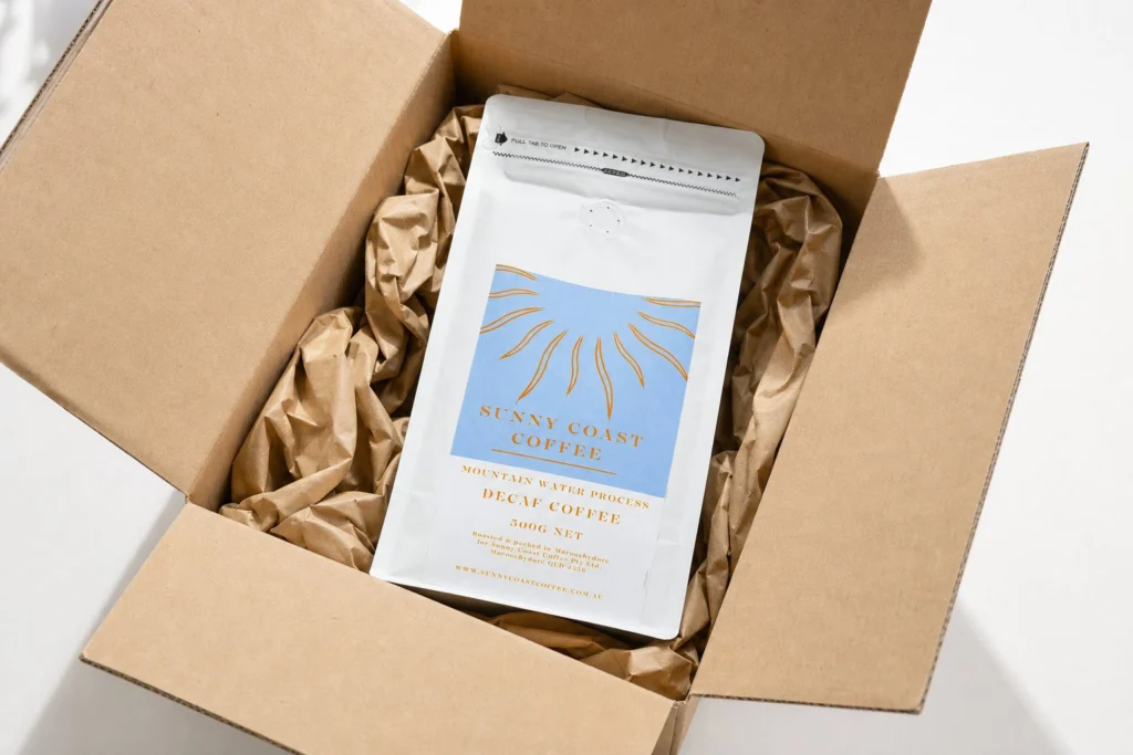 Decaf packed in a shipping box