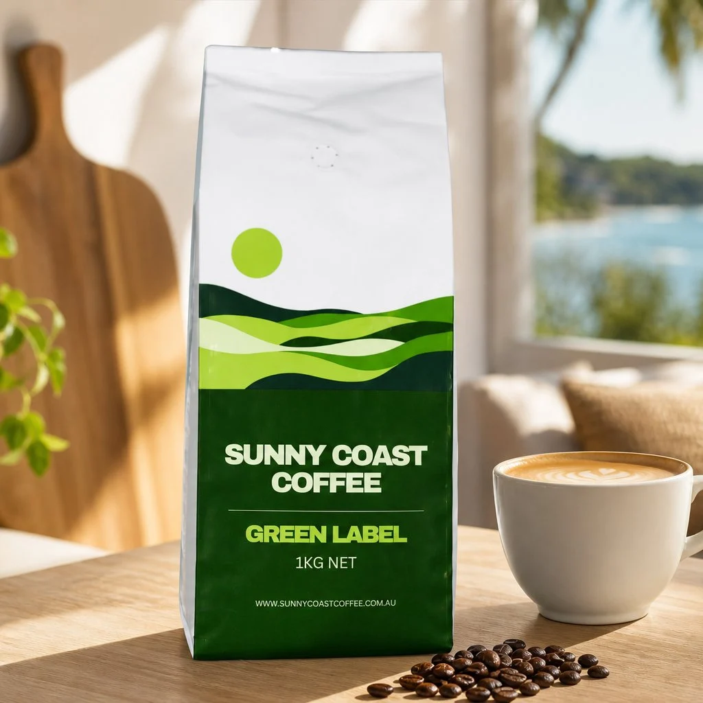 Sunny Coast Coffee Green Label on a kitchen bench with a flat white